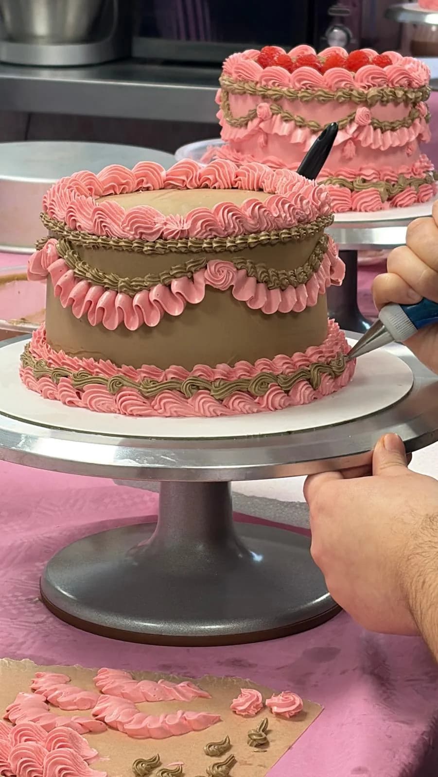 Cake decorating demonstration at the workbench
