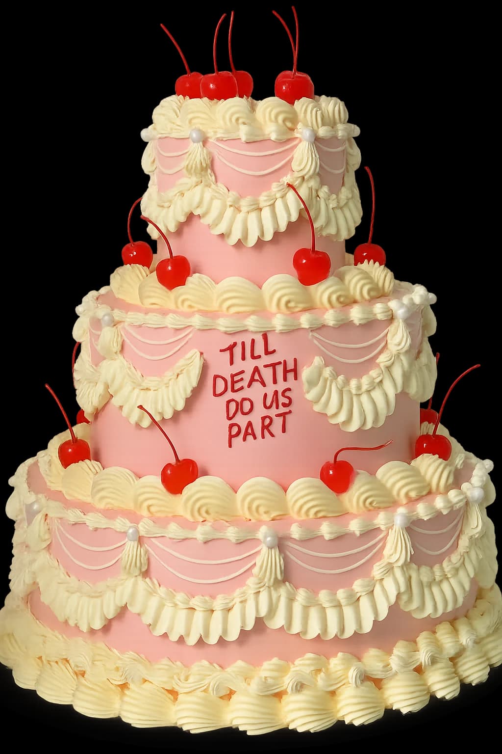 Three-tier vintage-style cake with piped buttercream, cherries and the words ‘Till death do us part’