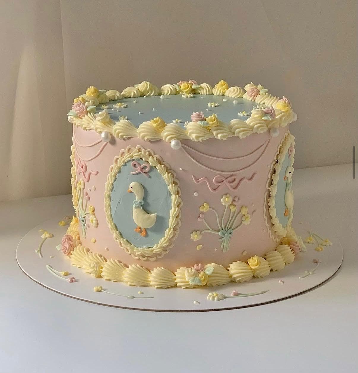 Silly goose themed baby celebration cake